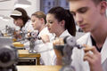 05 watchmaking apprentices at turning machines.jpg